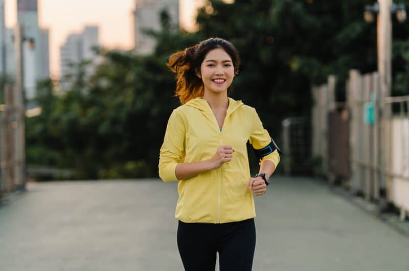 - beautiful young asia athlete lady running exercises work out urban environment japanese teen girl wearing sports clothes walkway bridge early morning lifestyle active sporty city - ภาพที่ 5