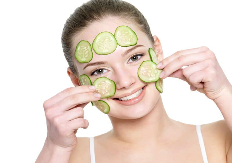 - cheerful happy beautiful girl applying facial mask cucumber isolated white - ภาพที่ 3