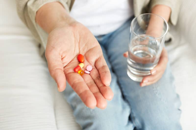 - pills tablets vitamins drugs heap mature hands - ภาพที่ 9