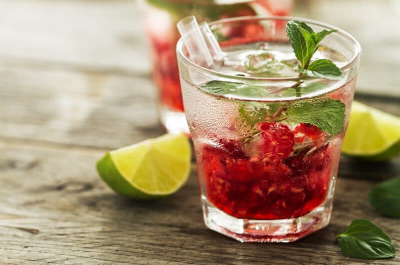 - tasty cold fresh drink lemonade with raspberry mint ice lime glass wooden background closeup - ภาพที่ 7