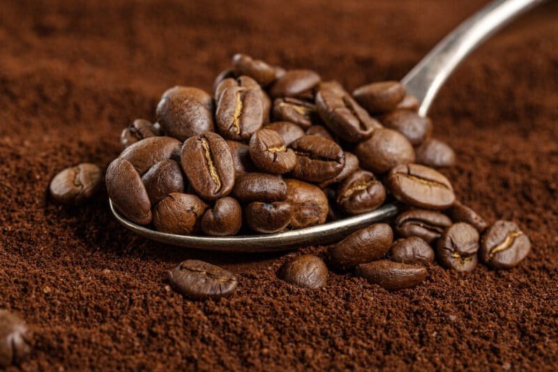 กากกาแฟ - coffee beans spoon ground coffee closeup - ภาพที่ 3