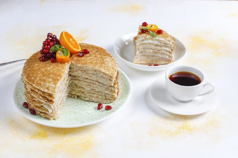 เนื้อเค้ก - delicious homemade crepe cake decorated with pomegranate seeds mandarins - ภาพที่ 15