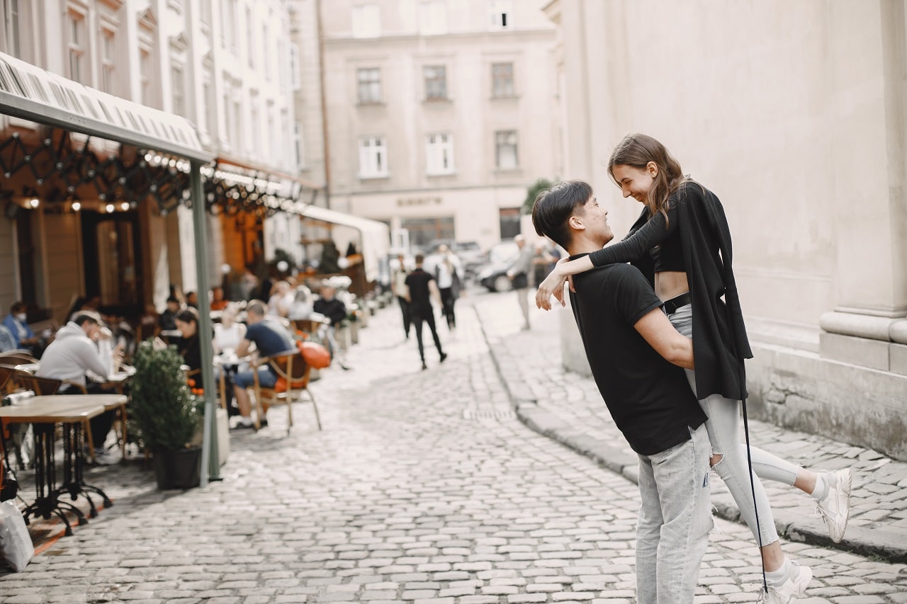 แคปชั่นความรัก - asian boy his caucasian girlfriend casual wear standing lviv street couple hugging each other while walking together city - ภาพที่ 3